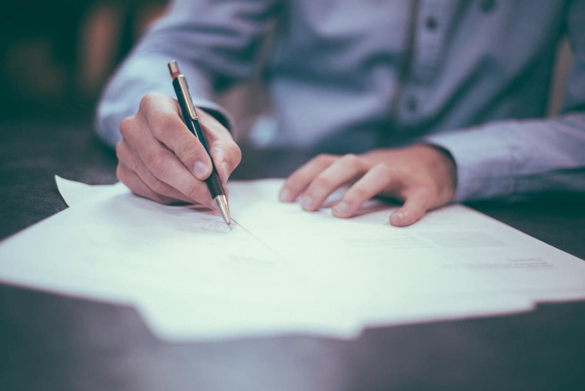 Person reviewing income documents for Dallas apartment application